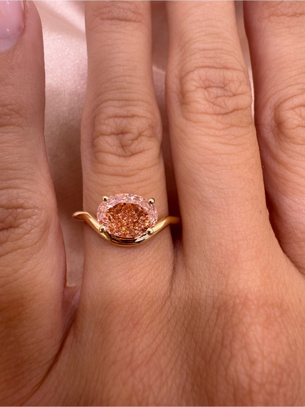 2.01 carat fancy intense pink VS1 east west oval solitaire engagement ring